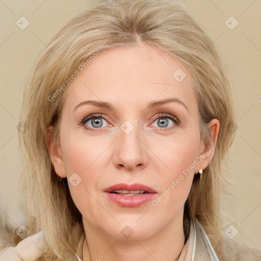 Joyful white adult female with medium  brown hair and grey eyes