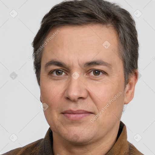 Joyful white adult male with short  brown hair and brown eyes