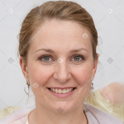 Joyful white adult female with medium  brown hair and blue eyes