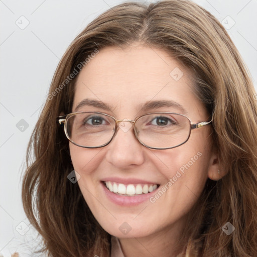 Joyful white young-adult female with long  brown hair and blue eyes