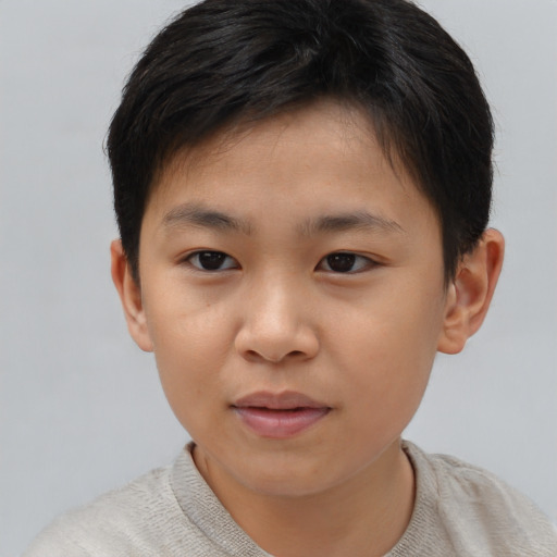 Joyful asian child female with short  brown hair and brown eyes