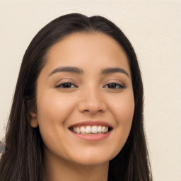 Joyful latino young-adult female with long  black hair and brown eyes