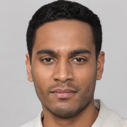Neutral latino young-adult male with short  black hair and brown eyes