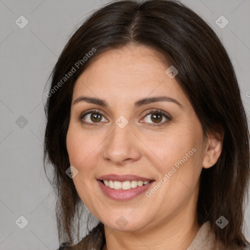 Joyful white adult female with medium  brown hair and brown eyes