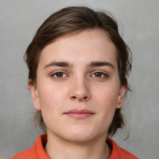 Neutral white young-adult female with medium  brown hair and brown eyes