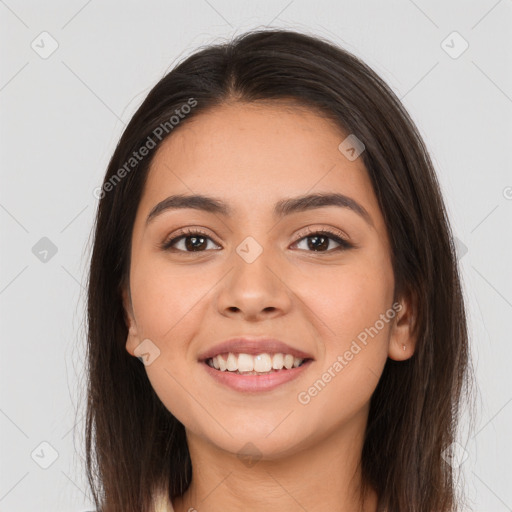 Joyful white young-adult female with long  brown hair and brown eyes