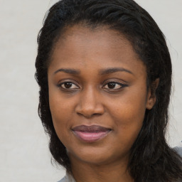 Joyful latino young-adult female with long  black hair and brown eyes