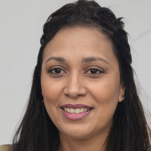 Joyful asian adult female with long  brown hair and brown eyes