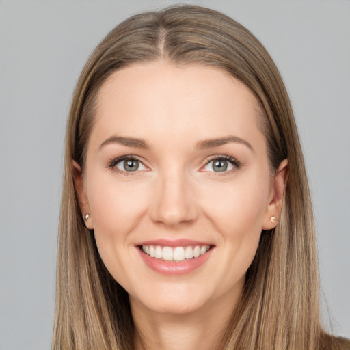 Joyful white young-adult female with long  brown hair and grey eyes