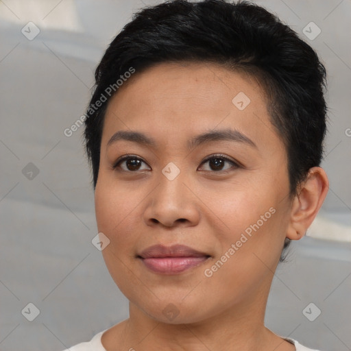 Joyful asian young-adult female with short  brown hair and brown eyes