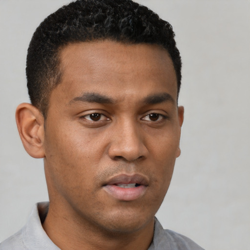 Neutral latino young-adult male with short  black hair and brown eyes