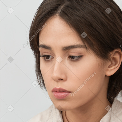 Neutral white young-adult female with medium  brown hair and brown eyes