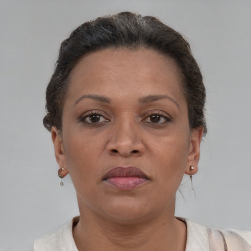 Neutral black adult female with short  brown hair and brown eyes