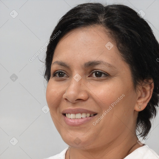 Joyful white adult female with medium  brown hair and brown eyes