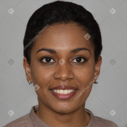 Joyful black young-adult female with short  black hair and brown eyes