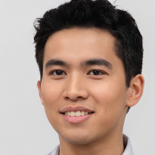 Joyful asian young-adult male with short  black hair and brown eyes