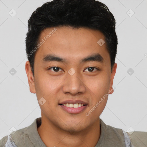 Joyful latino young-adult male with short  brown hair and brown eyes