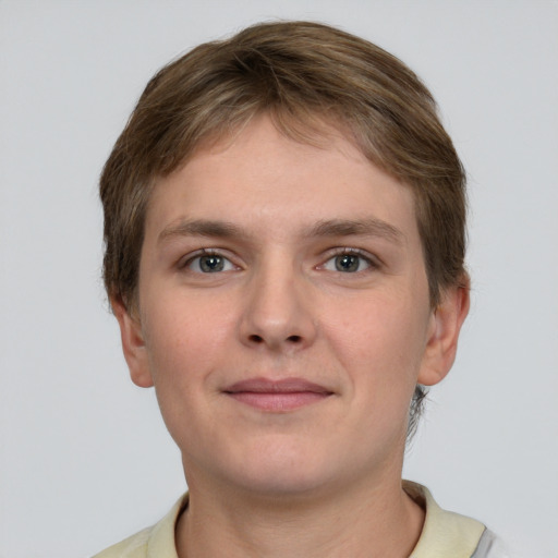 Joyful white young-adult female with short  brown hair and grey eyes