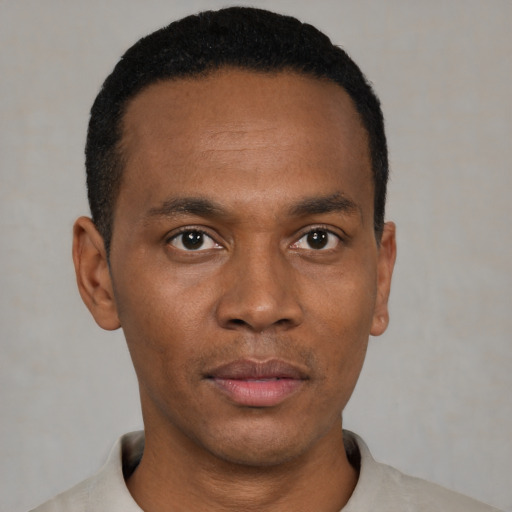 Neutral black young-adult male with short  black hair and brown eyes