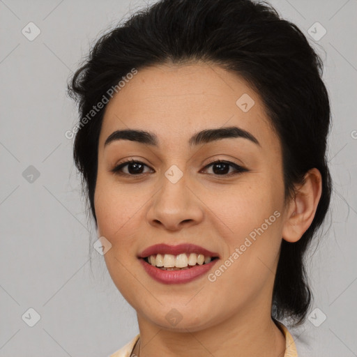 Joyful latino young-adult female with long  brown hair and brown eyes