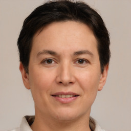 Joyful white adult female with short  brown hair and brown eyes