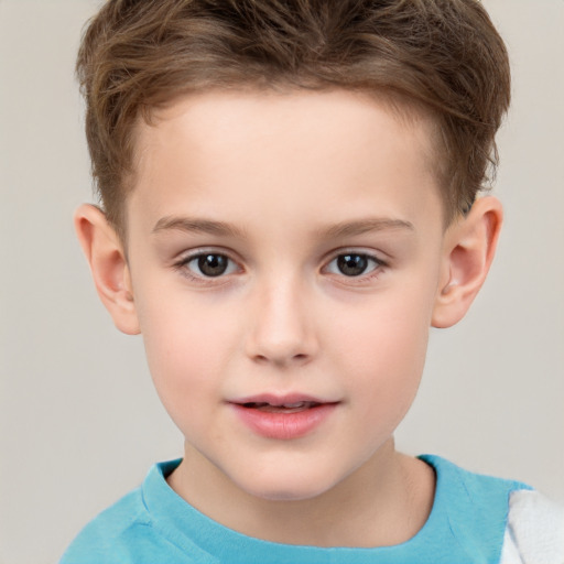 Joyful white child male with short  brown hair and brown eyes