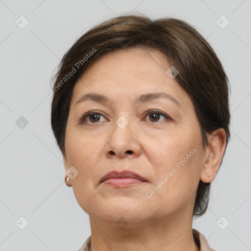 Joyful white adult female with short  brown hair and brown eyes