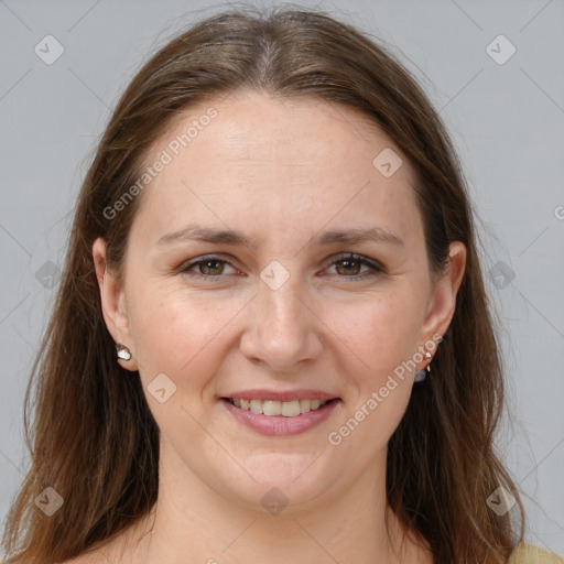 Joyful white adult female with long  brown hair and grey eyes