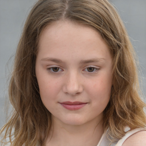 Joyful white child female with long  brown hair and brown eyes