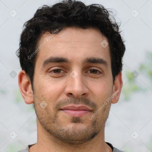 Joyful latino young-adult male with short  brown hair and brown eyes