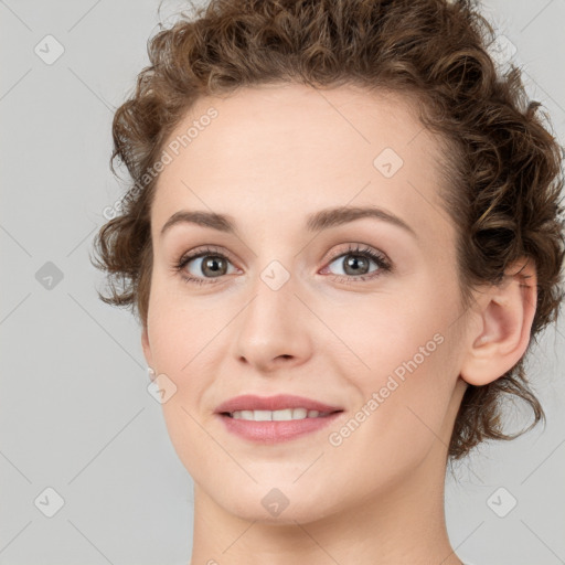 Joyful white young-adult female with medium  brown hair and green eyes