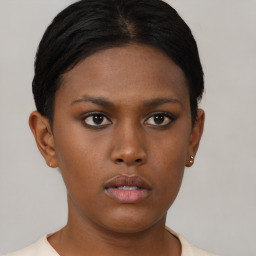 Neutral black young-adult female with short  brown hair and brown eyes