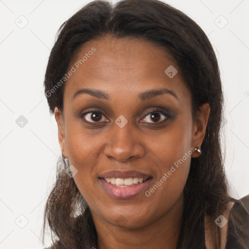 Joyful black young-adult female with long  brown hair and brown eyes