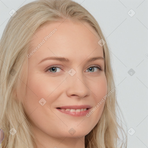 Joyful white young-adult female with long  blond hair and blue eyes