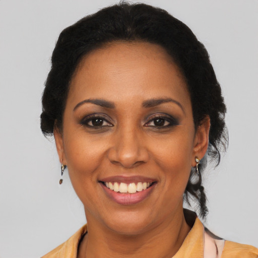 Joyful latino young-adult female with medium  black hair and brown eyes