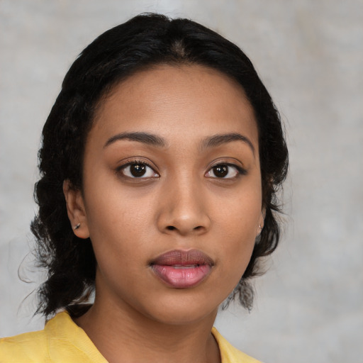 Neutral latino young-adult female with medium  brown hair and brown eyes