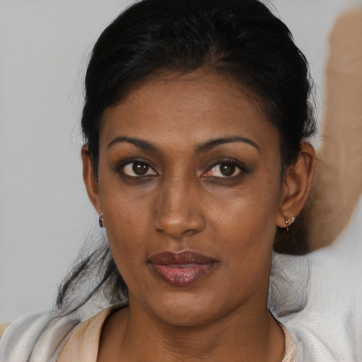 Neutral black adult female with short  brown hair and brown eyes
