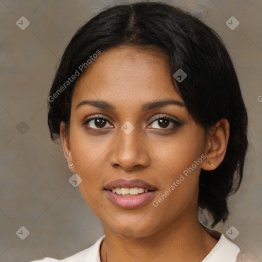 Joyful black young-adult female with medium  black hair and brown eyes