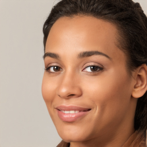 Joyful white young-adult female with long  brown hair and brown eyes