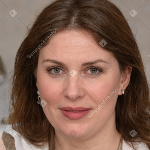 Joyful white adult female with medium  brown hair and grey eyes