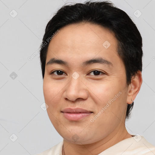 Joyful asian young-adult male with short  brown hair and brown eyes