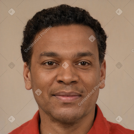 Joyful latino young-adult male with short  brown hair and brown eyes