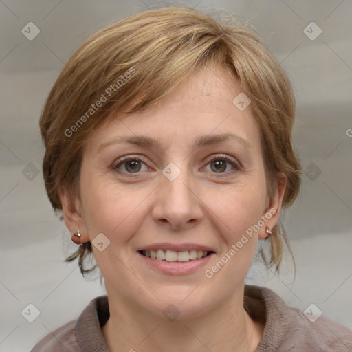 Joyful white adult female with medium  brown hair and grey eyes