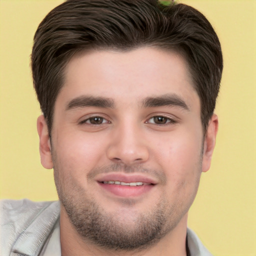 Joyful white young-adult male with short  brown hair and brown eyes