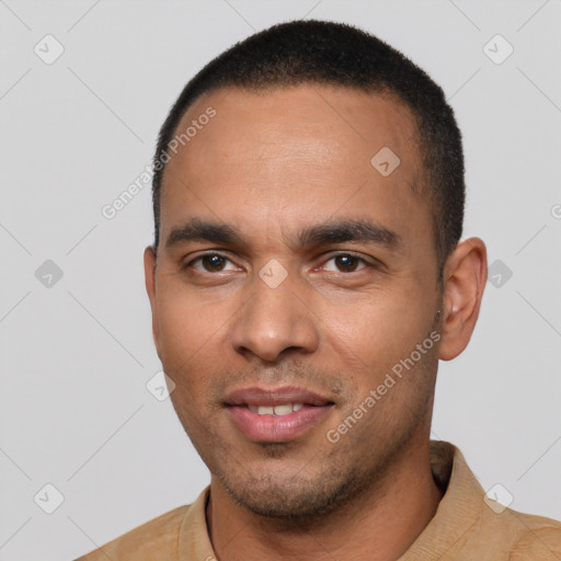 Joyful white young-adult male with short  black hair and brown eyes