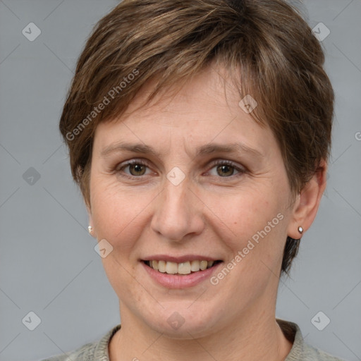 Joyful white adult female with medium  brown hair and grey eyes