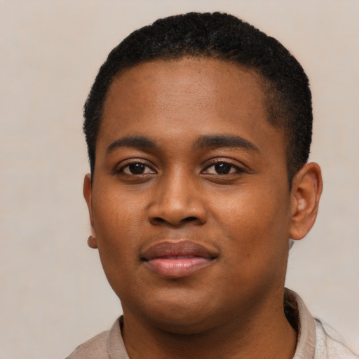 Joyful black young-adult male with short  black hair and brown eyes