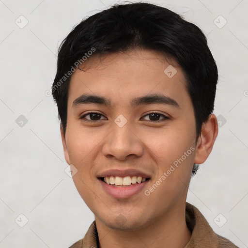 Joyful asian young-adult male with short  black hair and brown eyes