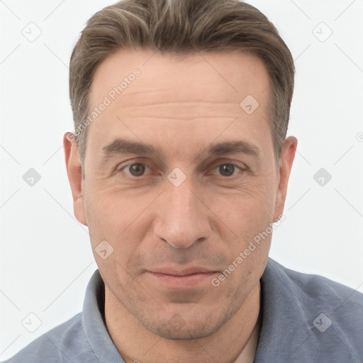 Joyful white adult male with short  brown hair and grey eyes