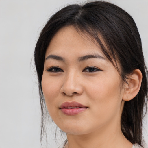 Joyful asian young-adult female with medium  brown hair and brown eyes